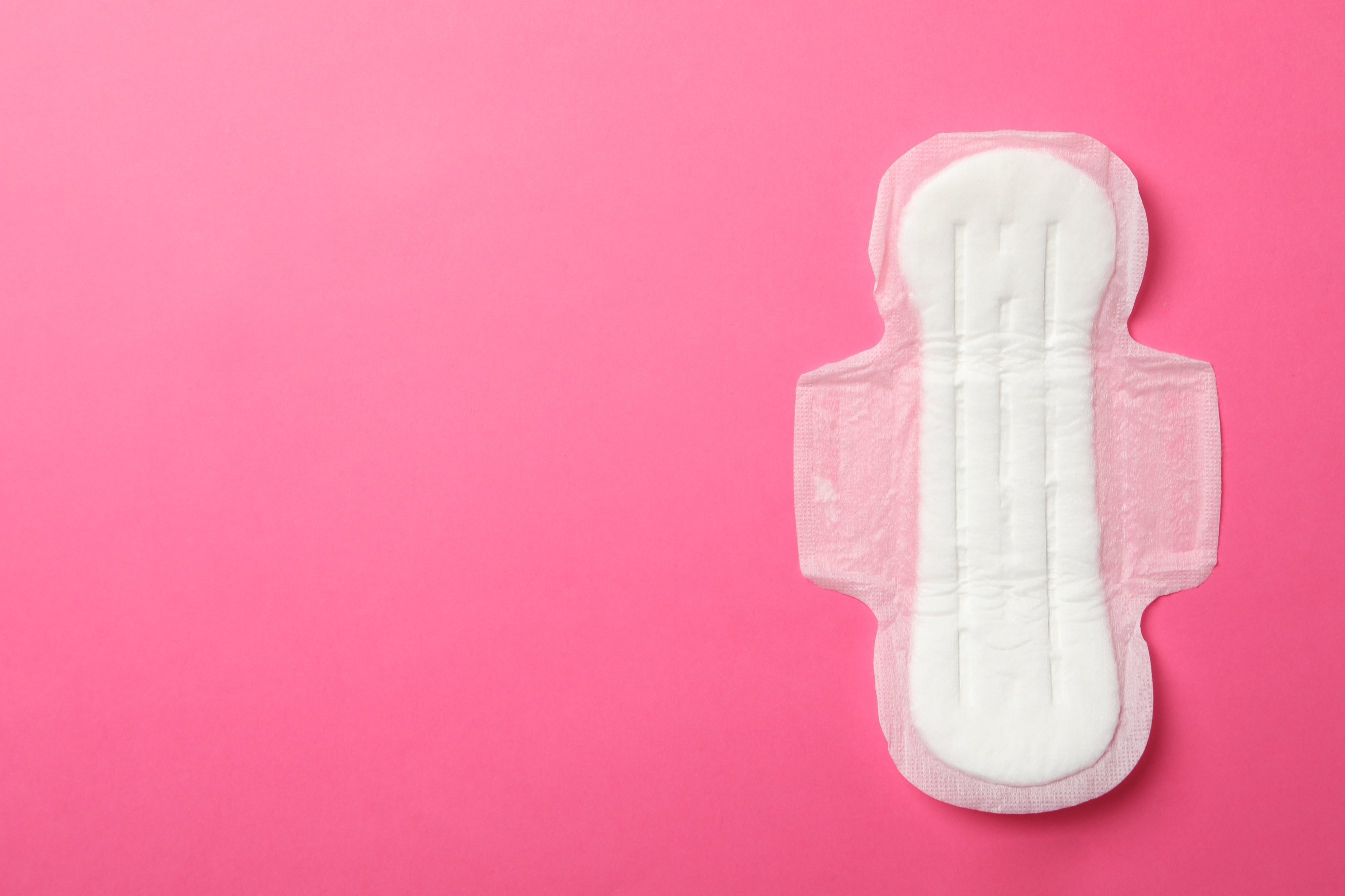 Sanitary Pad on Pink Background, Top View