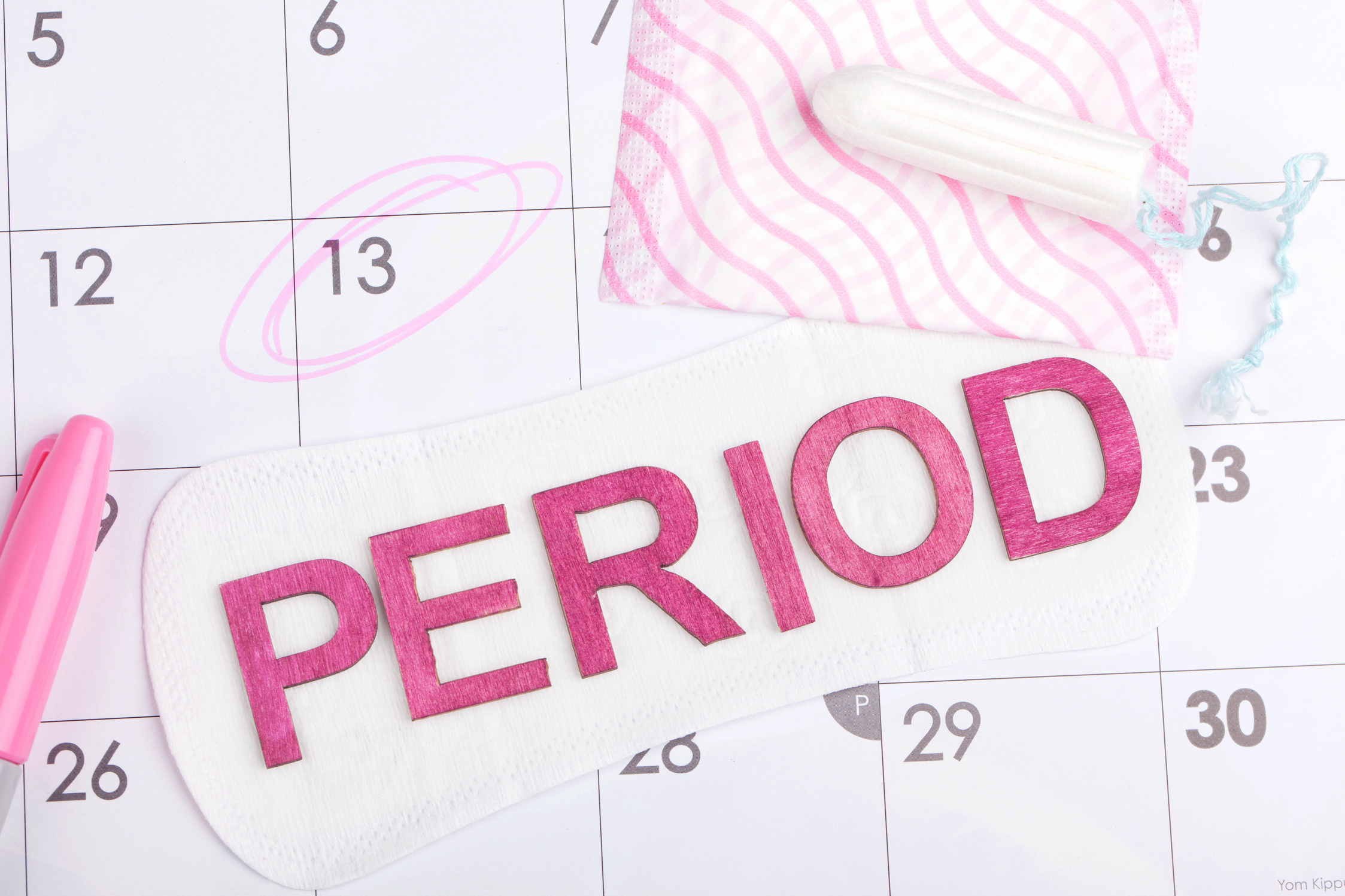 Period on calendar with tampon & sanitary pad